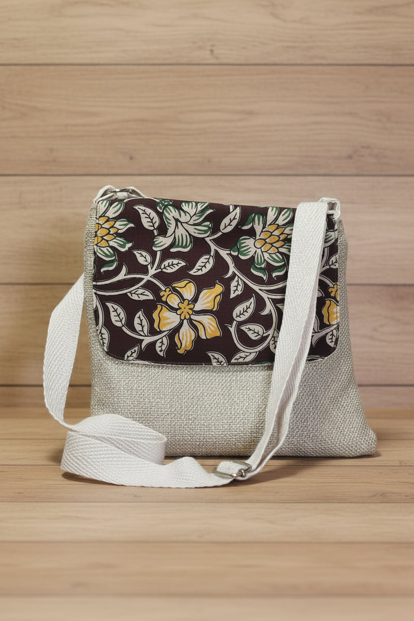  Jute fabric bag with Kalamkari patterned flap  crossbody bag with a beige strap on a green background background